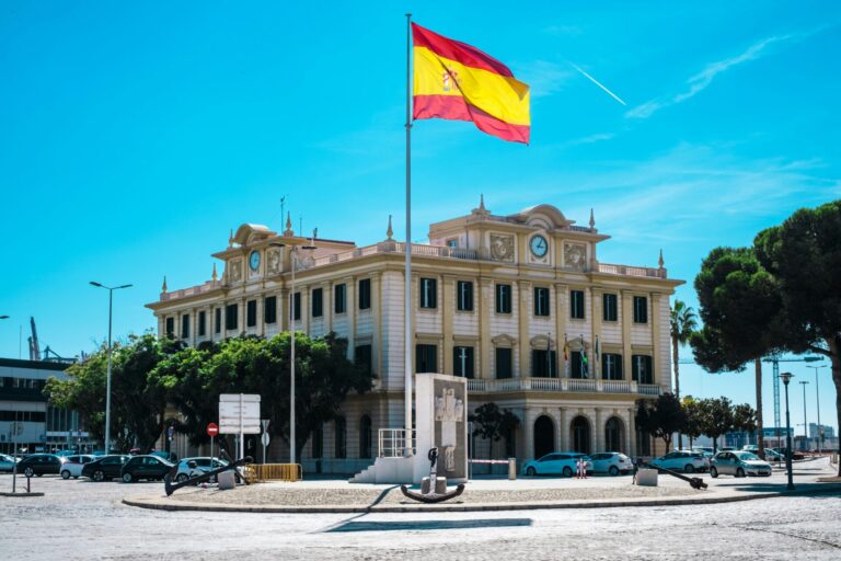 Spanish flag in front of a monument